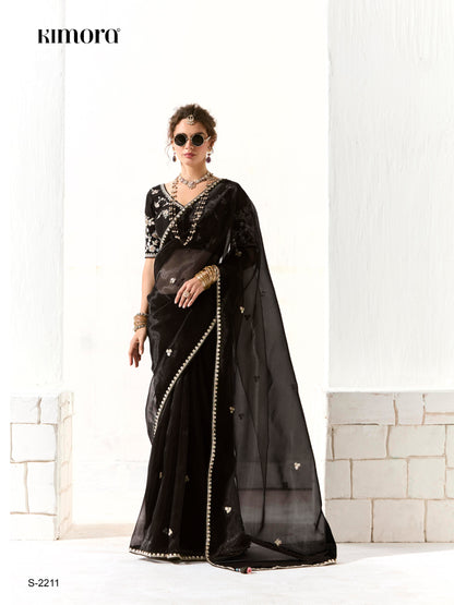 Royal Black Organza Saree with Black Embroidered Blouse – A Symphony of Power and Grace  Meta Description: