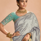 ELEGANT SILVER KANJIVARAM SILK SAREE WITH SEA GREEN EMBROIDERED BLOUSE