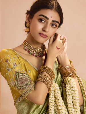 Radiant Green Kanjivaram Silk Saree with Ornate Yellow Blouse – A Regal Ensemble