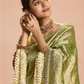 Radiant Green Kanjivaram Silk Saree with Ornate Yellow Blouse – A Regal Ensemble