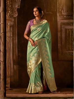 Sea Green Banarasi Silk Saree with Golden Zari Weaving Paired with a Contrast Purple Silk Blouse By Kimora
