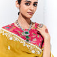 Woman wearing a traditional saree with jewelry against a white background
