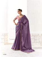 Woman wearing a purple saree with a white background