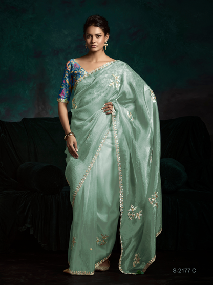 Mint Green Organza Saree with Blue Printed Blouse and Lace Border
