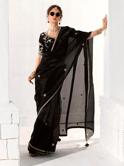 Royal Black Organza Saree with Black Embroidered Blouse – A Symphony of Power and Grace  Meta Description: