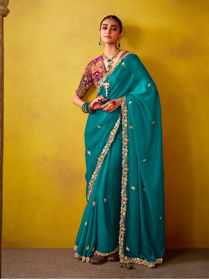 Teal Green Tissue Silk Saree with Embroidered Border and Contrast Floral Blouse