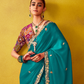 Teal Green Tissue Silk Saree with Embroidered Border and Contrast Floral Blouse