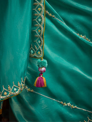 TEAL DESIGNER ORGANZA SAREE WITH HANDCRAFTED EMBROIDERED BORDER – BOLD, ELEGANT, UNFORGETTABLETeal Green Designer Organza Silk Saree