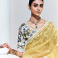 GRACEFUL YELLOW SAREE WITH FLORAL-PRINT BLOUSE – RADIANT ELEGANCE