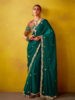Green Tissue Silk Saree with Embroidered Border and Floral Contrast Blouse