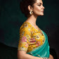 TEAL DESIGNER ORGANZA SAREE WITH HANDCRAFTED EMBROIDERED BORDER – BOLD, ELEGANT, UNFORGETTABLETeal Green Designer Organza Silk Saree