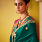 Green Tissue Silk Saree with Embroidered Border and Floral Contrast Blouse