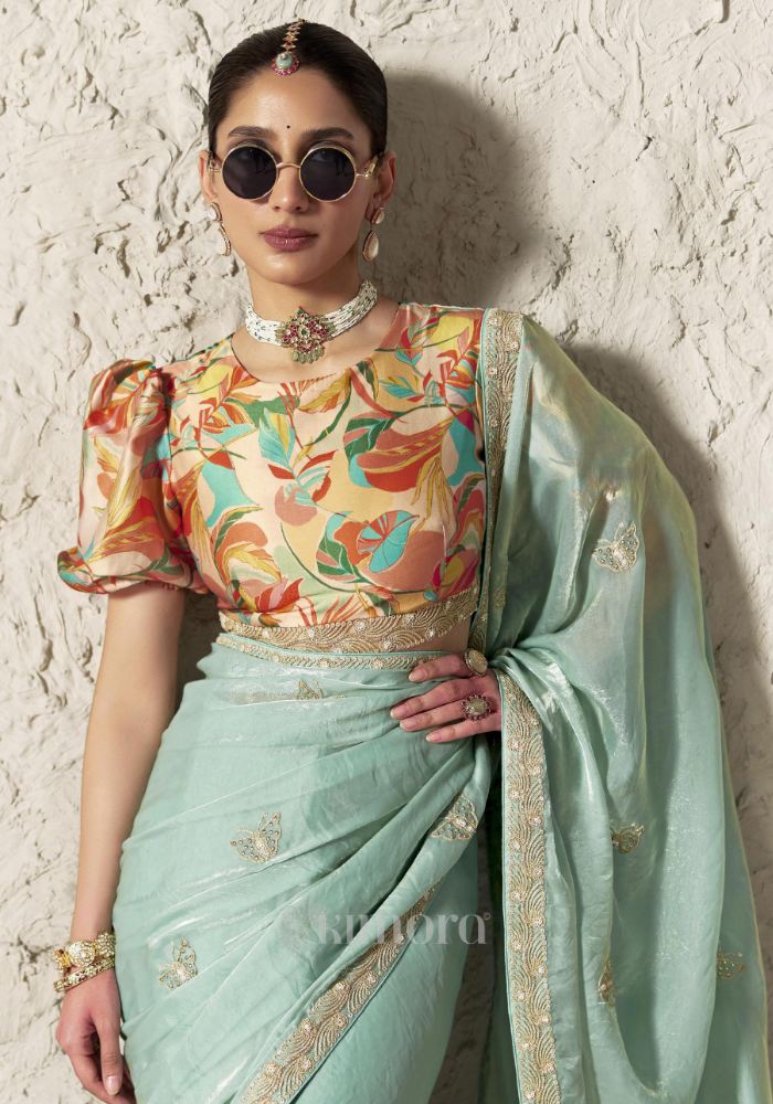 Aqua Blue Soft Silk Saree Close-Up with Gold Butterfly Embroidery, Zari Sequin Work and Ornate Lace Border, Luxury Daytime Celebration Wear