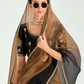 Woman wearing a black and gold embroidered blouse with a brown dupatta against a light gray background