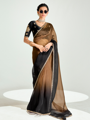 Woman wearing a black and brown saree with sunglasses on a white background