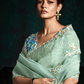 Mint Green Organza Saree with Blue Printed Blouse and Lace Border