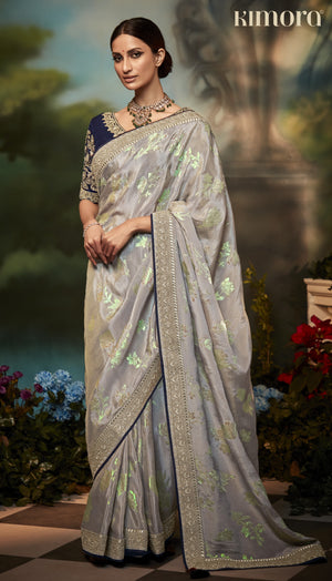 Pastel Grey Silk Saree with Floral Zari Work and Royal Blue Embroidered Blouse – Kimora