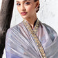 Blue-violet digitally printed satin silk blouse paired with a premium silver to cobalt blue ombre designer saree.