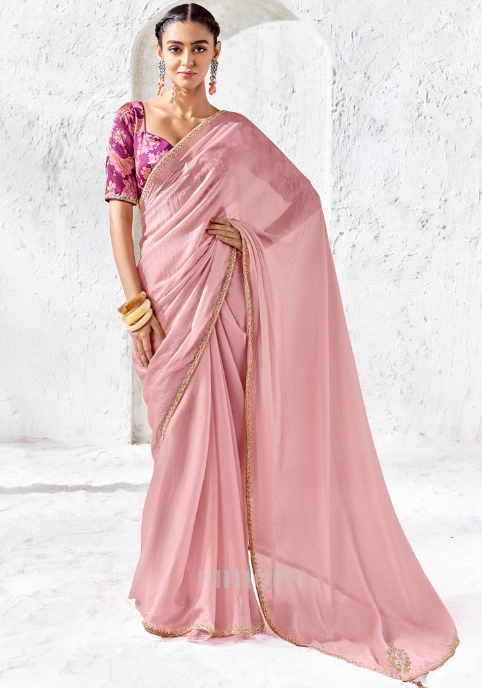 Blush pink Tissue Silk saree with zari, sequins and bead embroidery paired with a magenta digitally printed satin silk blouse by Kimora.