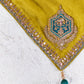 Close-up of the chartreuse yellow saree showcasing intricate zari, sequins and bead embroidered border with elegant craftsmanship.