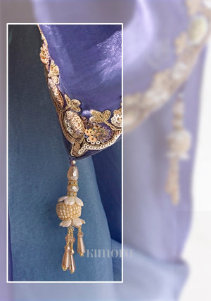 Close-up of the ombre Soft Shimmer Tissue Silk saree showcasing intricate zari, sequins and bead embroidered border.