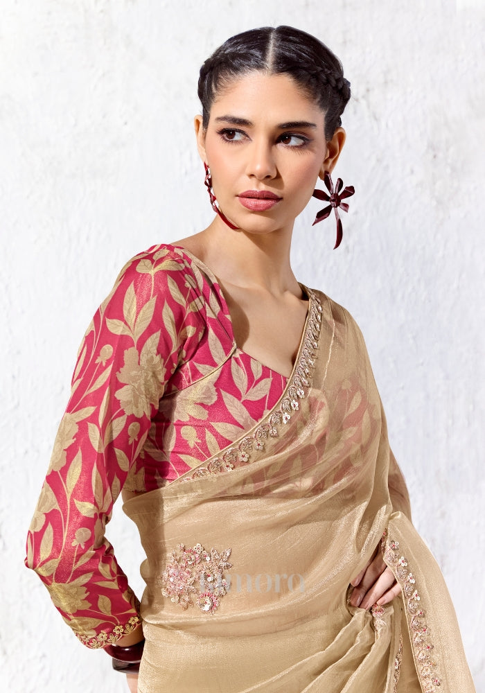 Digitally printed satin silk blouse in red with floral print paired with a premium champagne gold embroidered Mulberry Cotton Silk saree.