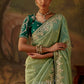 elegant green saree with an embroidered border