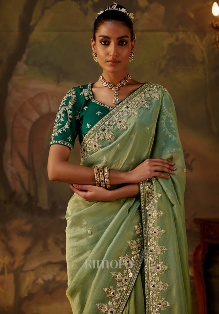 elegant green saree with an embroidered border