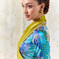 Elegant chartreuse yellow festive saree with shimmering tissue silk fabric, embroidered border and teal printed blouse for haldi and wedding celebrations.