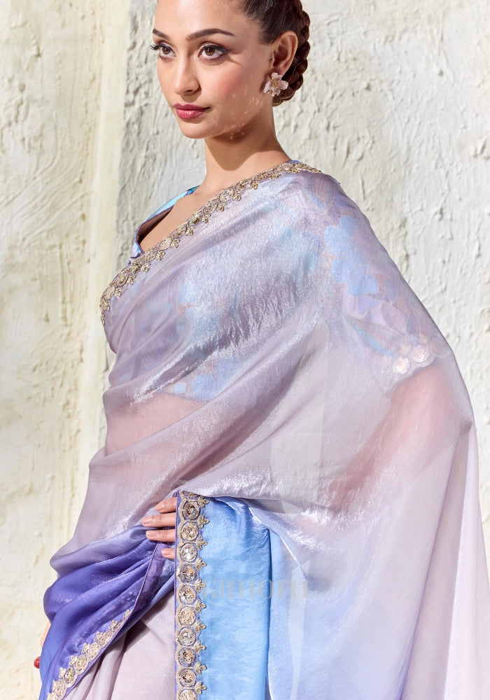 Elegant ombre designer saree in silver, lilac and cobalt blue with embroidered border, perfect for weddings, receptions and cocktail celebrations.