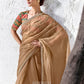 Gold designer saree paired with green and red digitally printed satin silk blouse