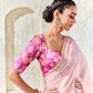 Magenta digitally printed satin silk blouse with floral design paired with a premium blush pink embroidered Tissue Silk saree.