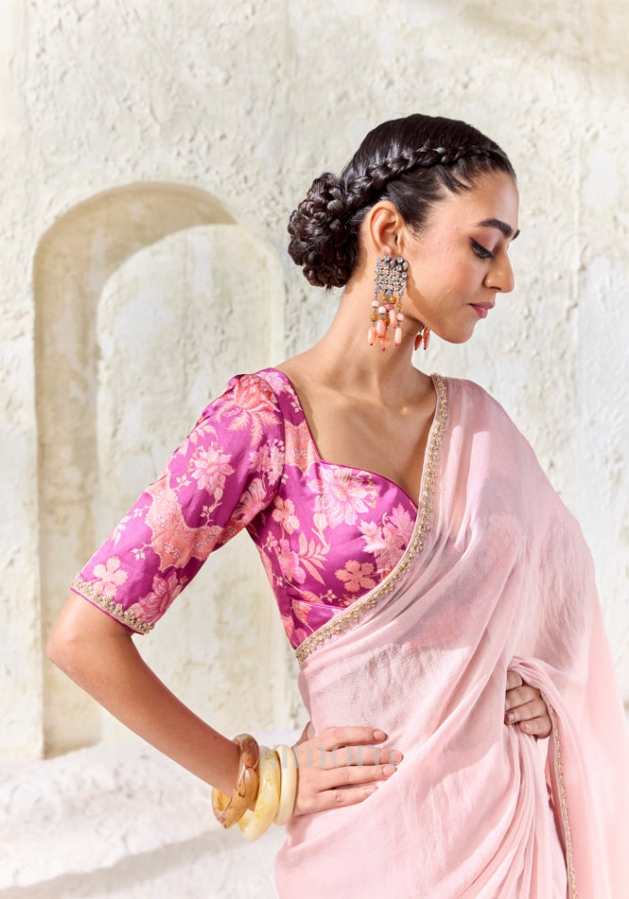 Magenta digitally printed satin silk blouse with floral design paired with a premium blush pink embroidered Tissue Silk saree.