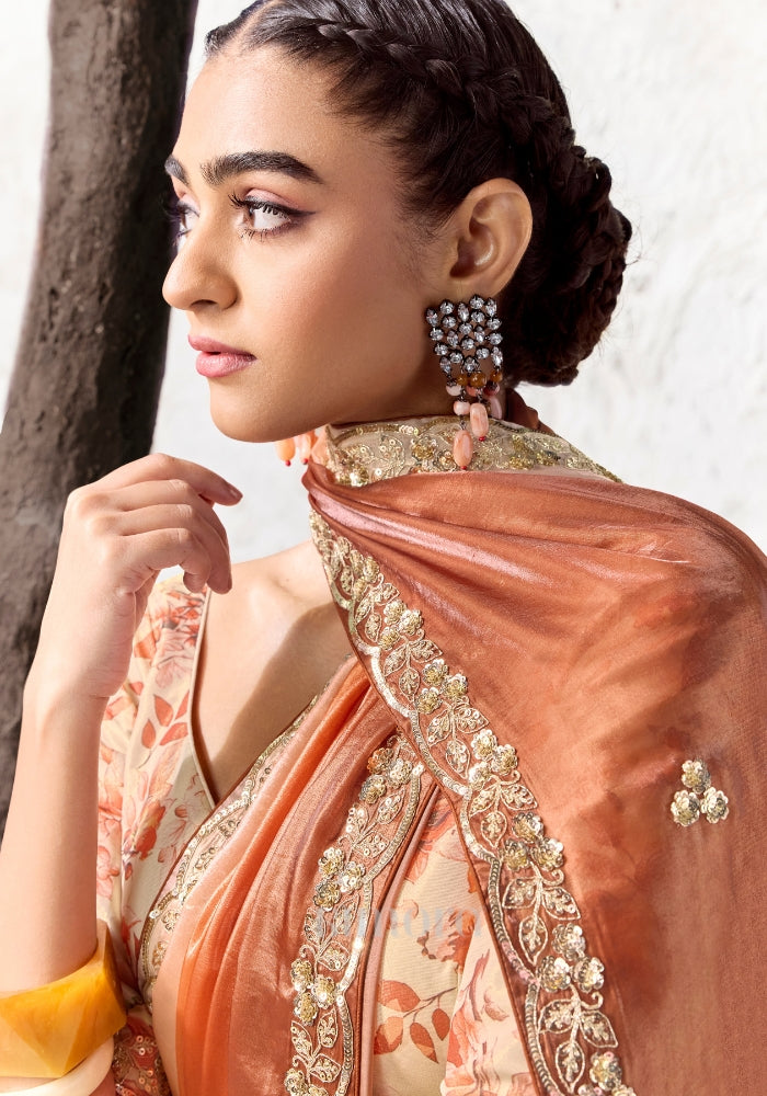 Orange floral printed satin silk blouse paired with a premium ivory to burnt orange ombre Soft Shimmer Tissue Silk saree.