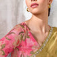 Pink linen satin blouse with oversized botanical floral print paired with olive gold saree