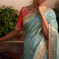 Light Blue Silk Zari Weaved Saree with Broad Border & Red Embroidered Blouse