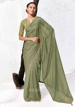 Sage green Tissue Silk saree with zari, sequins and bead embroidery paired with a green and gold digitally printed satin silk blouse by Kimora.