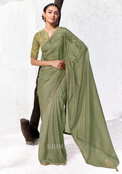 Sage green Tissue Silk saree with zari, sequins and bead embroidery paired with a green and gold digitally printed satin silk blouse by Kimora.