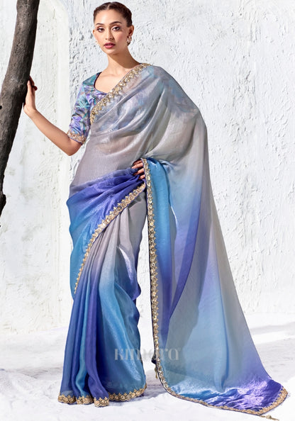 Silver, lilac and cobalt blue ombre Soft Shimmer Tissue Silk saree with zari, sequins and bead embroidery paired with a blue-violet printed satin silk blouse by Kimora.