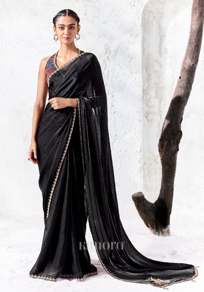 Black soft shimmer tissue silk saree with swan and floral bead embroidery and gold lace border