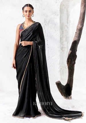 Black soft shimmer tissue silk saree with swan and floral bead embroidery and gold lace border