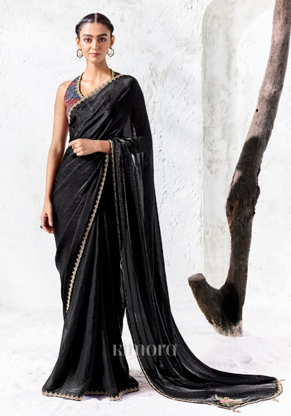Black soft shimmer tissue silk saree with swan and floral bead embroidery and gold lace border