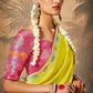Yellow saree paired with a red blouse