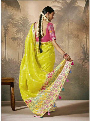Yellow saree paired with a red blouse