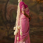 Back view of a pink embroidered blouse 