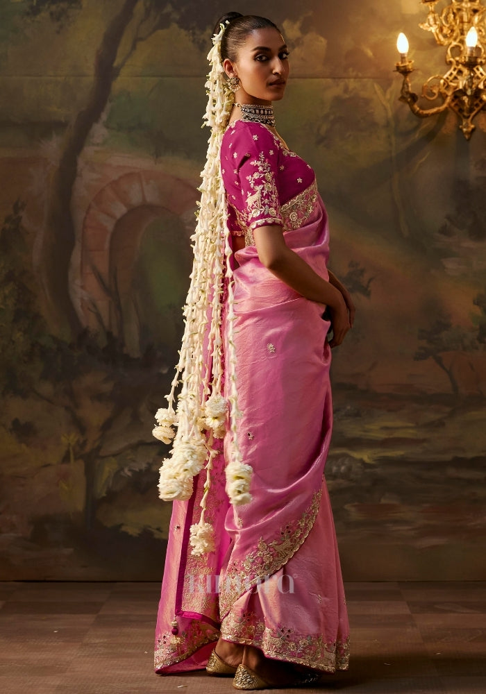 Back view of a pink embroidered blouse 