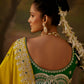  embellished green blouse and jewelry”