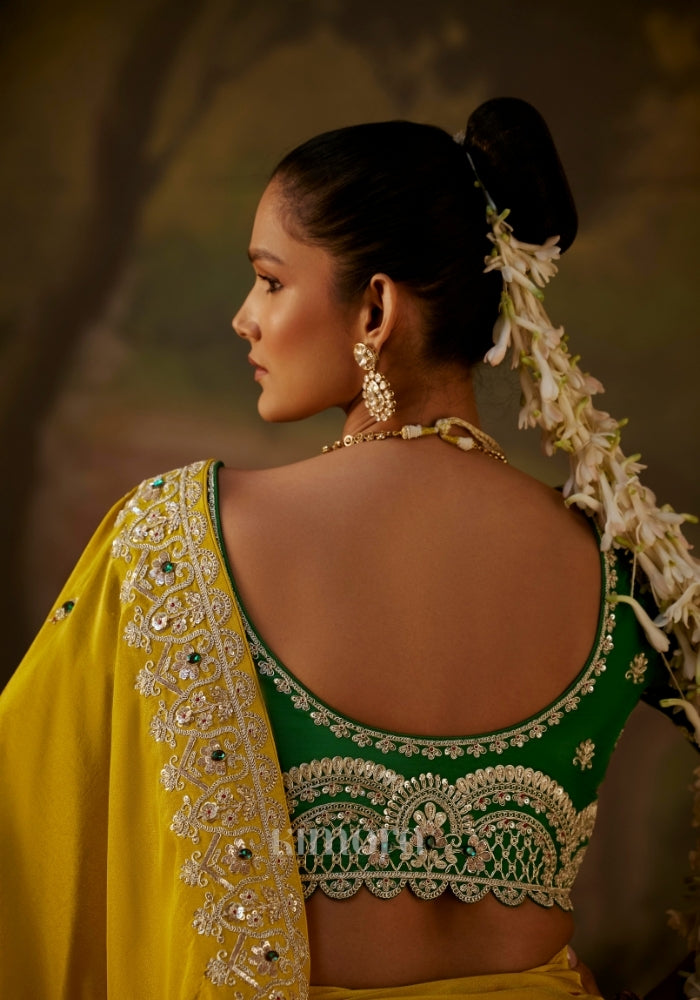  embellished green blouse and jewelry”