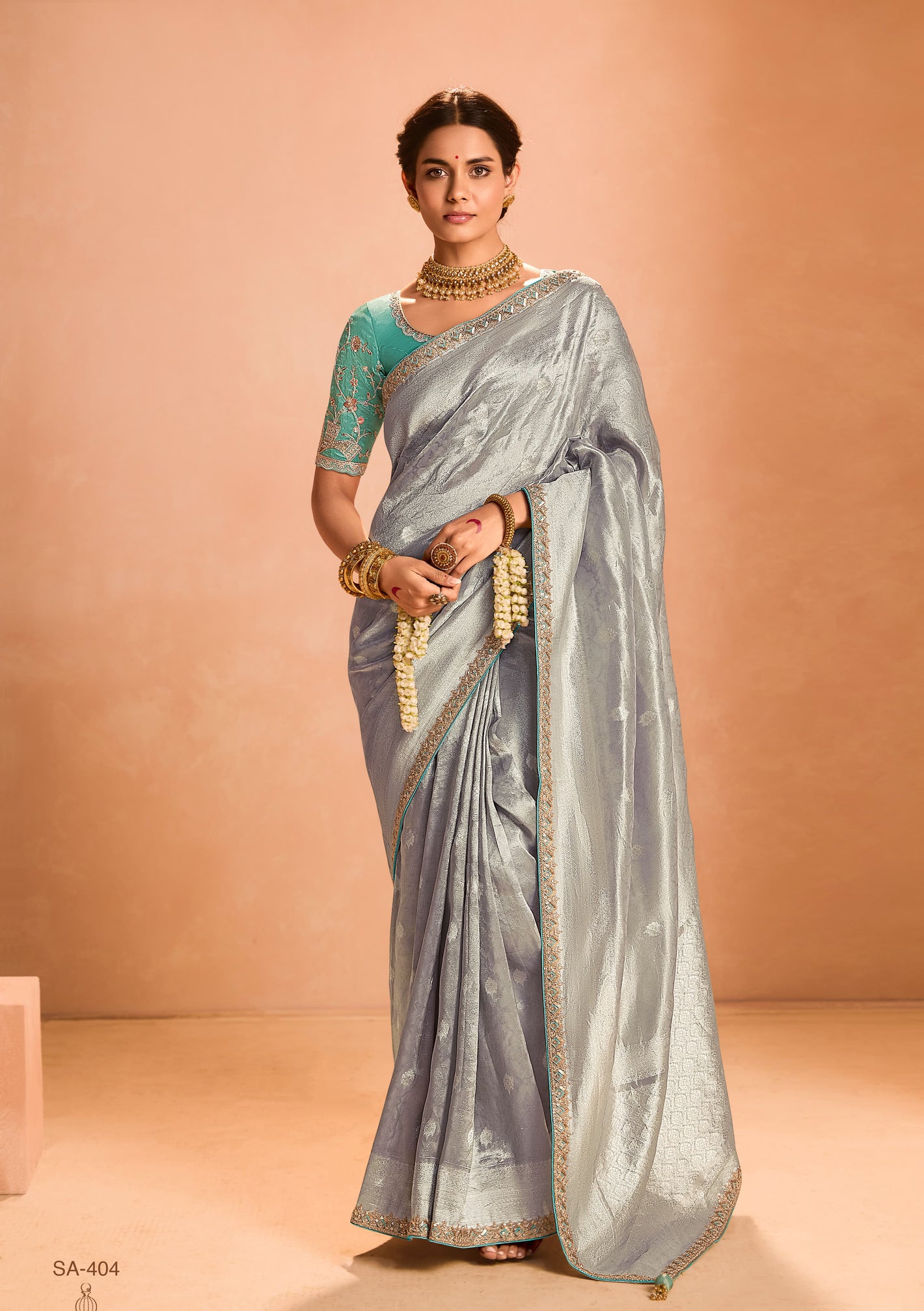 Elegant Silver Kanjivaram Silk Saree with Sea Green Embroidered Blouse – A Timeless Masterpiece