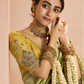 Radiant Green Kanjivaram Silk Saree with Ornate Yellow Blouse – A Regal Ensemble